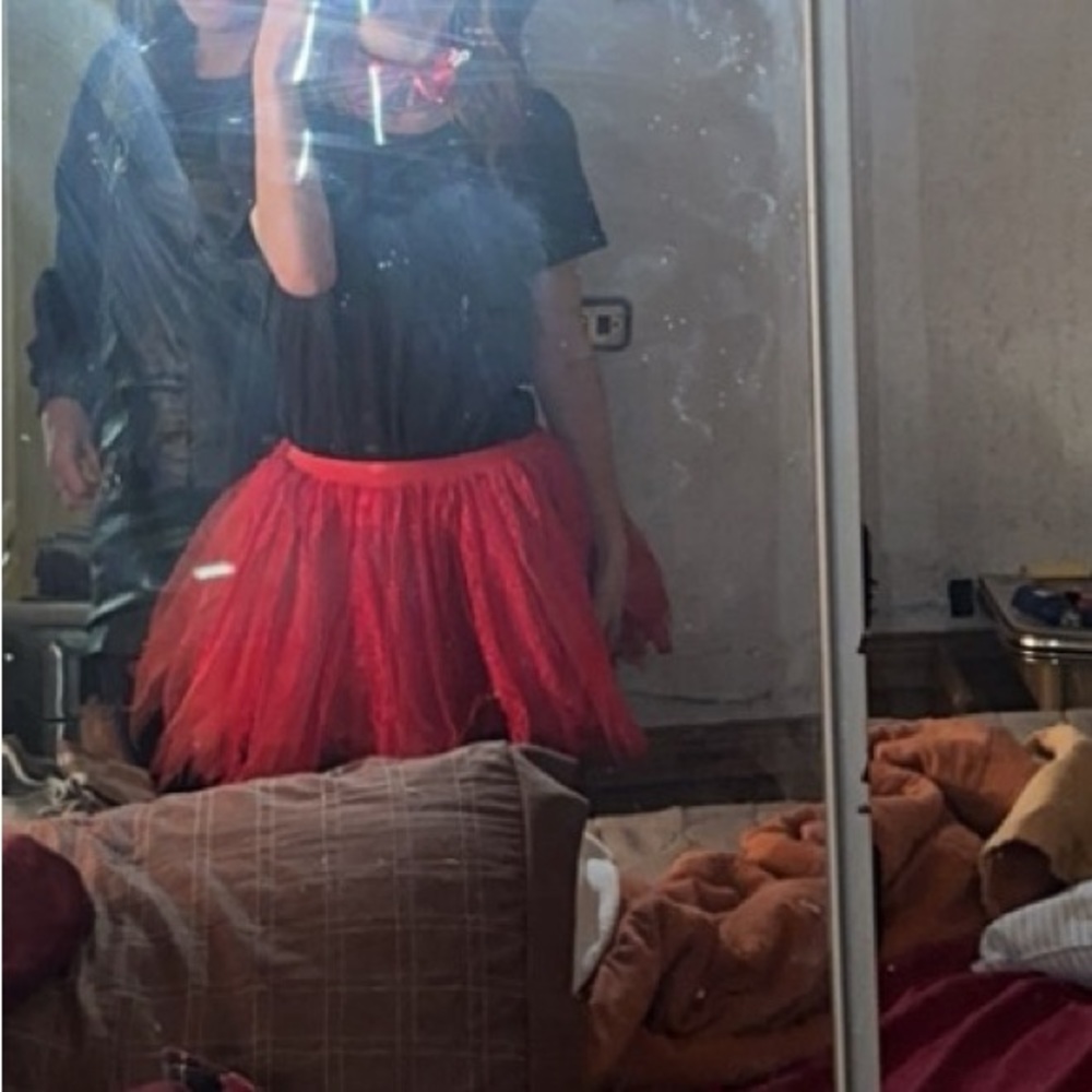 selling a red tutu and bow